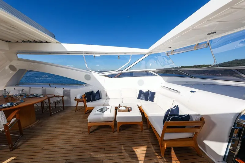 Frivolous Yacht Photos Pics Luxurious Sunseeker 34 Metre Yacht 2009, featuring elegant outdoor seating and ocean views.