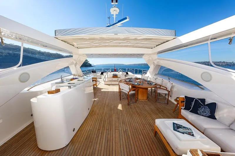 Frivolous Yacht Photos Pics Luxurious Sunseeker 34 Metre Yacht 2009 with spacious deck, elegant seating, and ocean views.