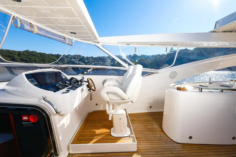 Frivolous Yacht Photos Pics Luxurious Sunseeker 34 Metre Yacht 2009 helm with sleek design and scenic ocean view.