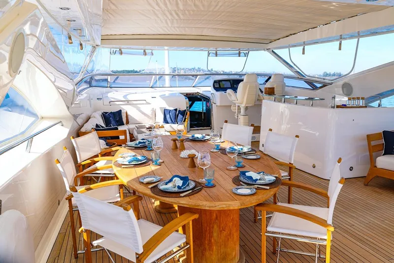 Frivolous Yacht Photos Pics Luxurious dining area on a 2009 Sunseeker 34 Metre Yacht, featuring elegant table settings.