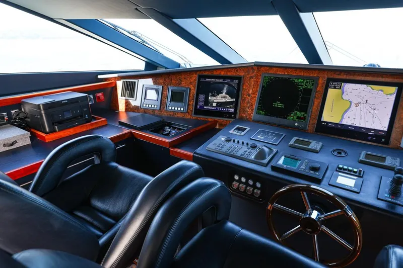 Frivolous Yacht Photos Pics Cockpit of 2009 Sunseeker 34 Metre Yacht with advanced navigation systems and luxurious seating.