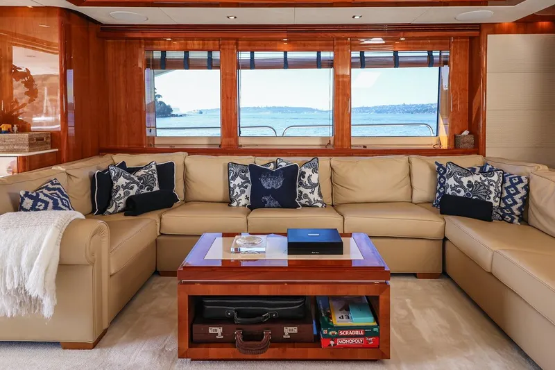 Frivolous Yacht Photos Pics Luxurious interior of 2009 Sunseeker 34 Metre Yacht with elegant seating and ocean view.