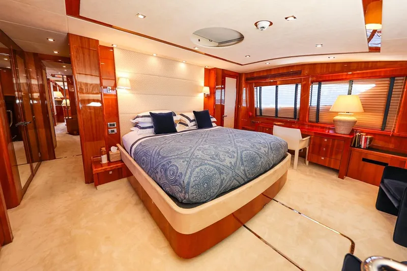 Frivolous Yacht Photos Pics Luxurious bedroom interior on 2009 Sunseeker 34 Metre Yacht with elegant wood finishes.