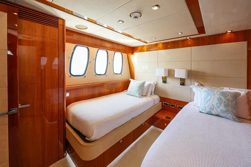 Frivolous Yacht Photos Pics Luxurious twin bedroom on 2009 Sunseeker 34 Metre Yacht with elegant wood finishes.