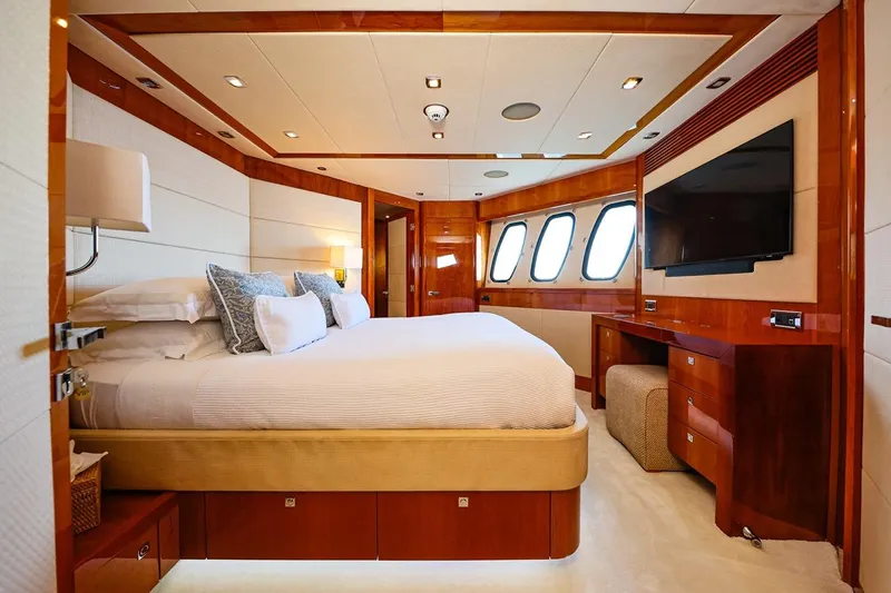 Frivolous Yacht Photos Pics Luxurious bedroom interior of 2009 Sunseeker 34 Metre Yacht with elegant wood finishes.