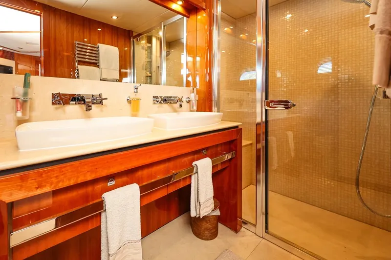 Frivolous Yacht Photos Pics Luxurious bathroom on 2009 Sunseeker 34 Metre Yacht with dual sinks and glass shower.