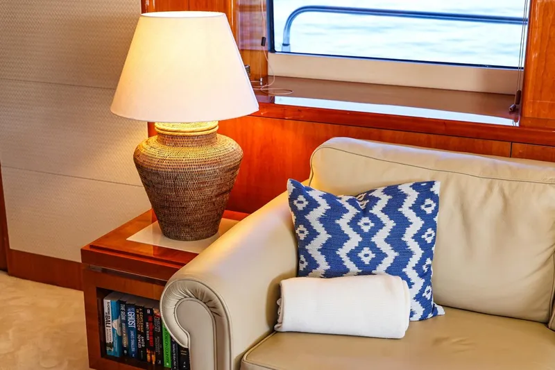 Frivolous Yacht Photos Pics Luxurious Sunseeker 34 Metre Yacht interior with cozy seating, lamp, and decorative pillow, 2009 model.