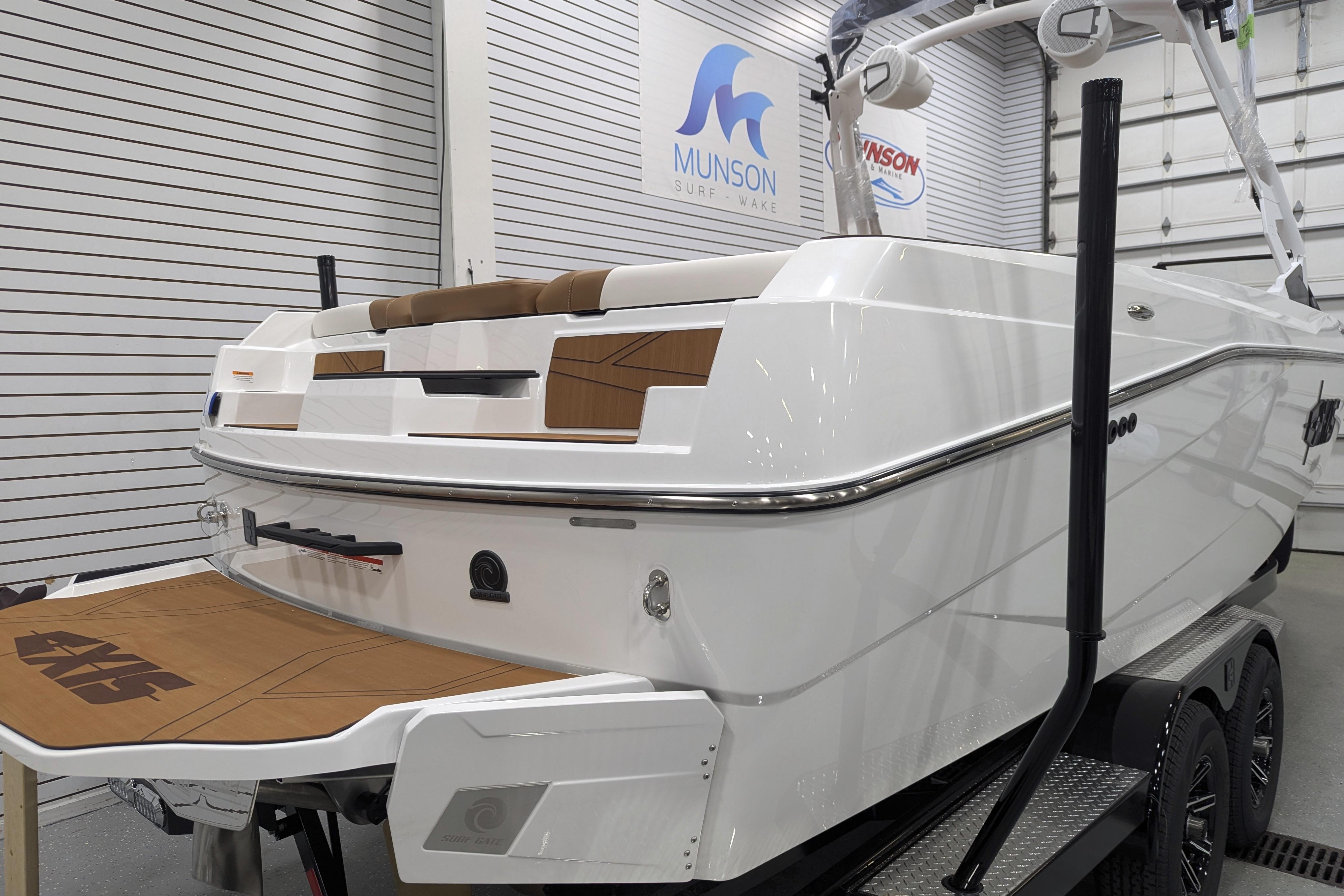 2026 Axis T250 boat in showroom, featuring sleek design and modern amenities.