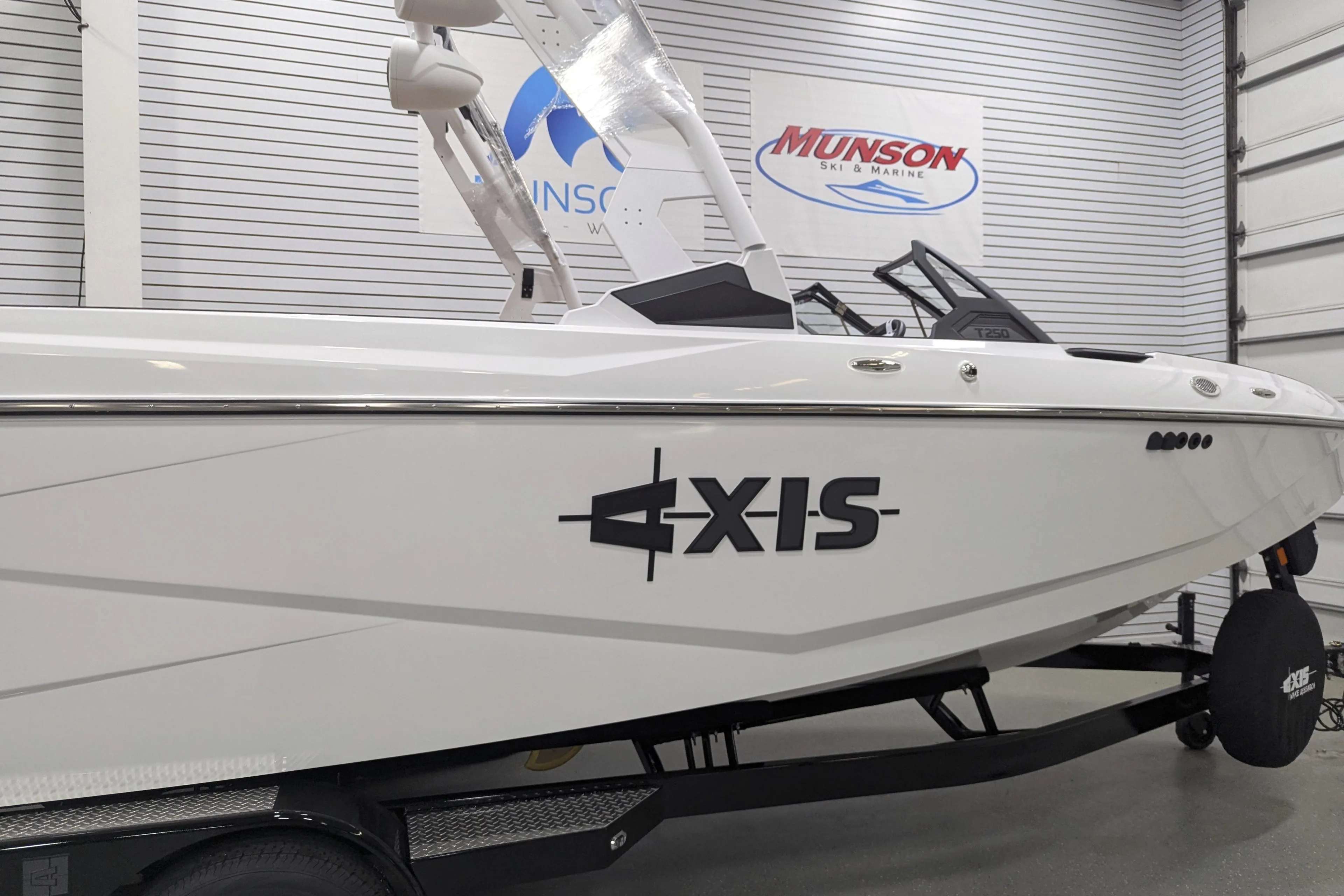 2026 Axis T250 boat displayed indoors at Munson Ski & Marine showroom.