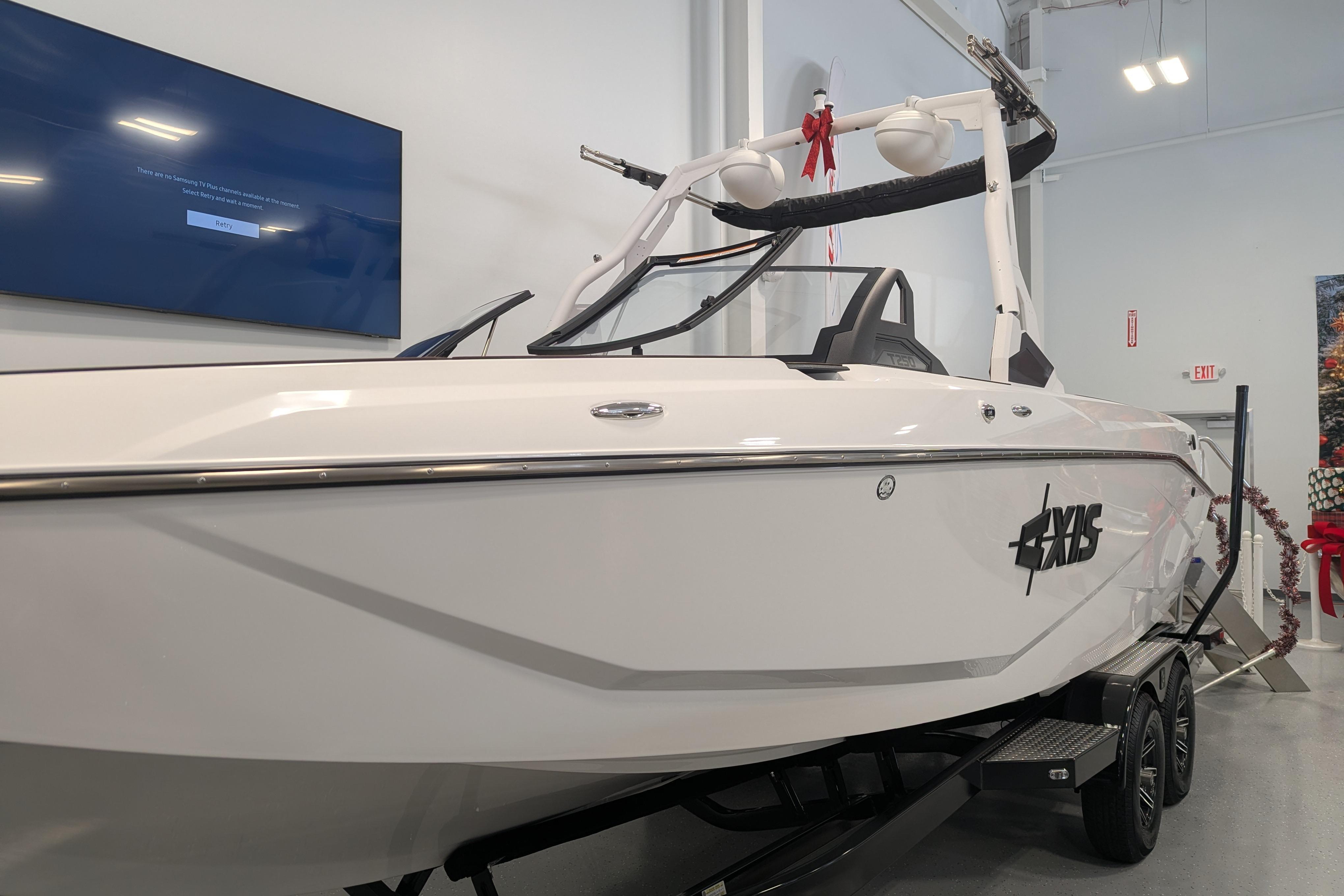 2026 Axis T250 boat displayed indoors with sleek design and modern features.