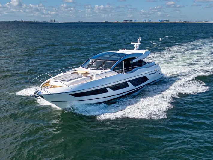 1031-ex Yacht Photos Pics 2020 Sunseeker Predator 74 yacht cruising on open water.