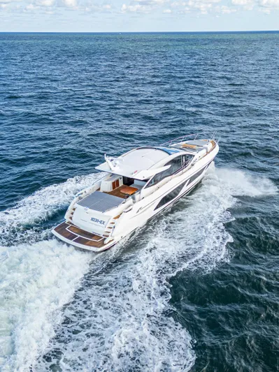1031-ex Yacht Photos Pics Sunseeker Predator 74 yacht cruising on open sea, 2020 model.