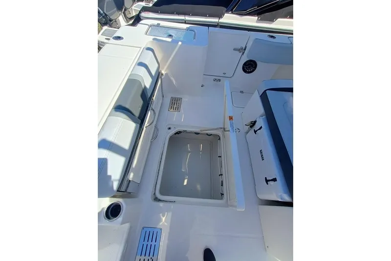 300-115 Yacht Photos Pics 2025 Robalo R300 Center Console boat interior with open storage compartment.