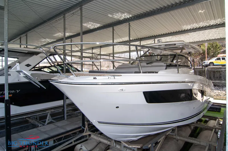 Yacht Photos Pics 2024 Jeanneau Leader 10.5 WA boat in covered storage.