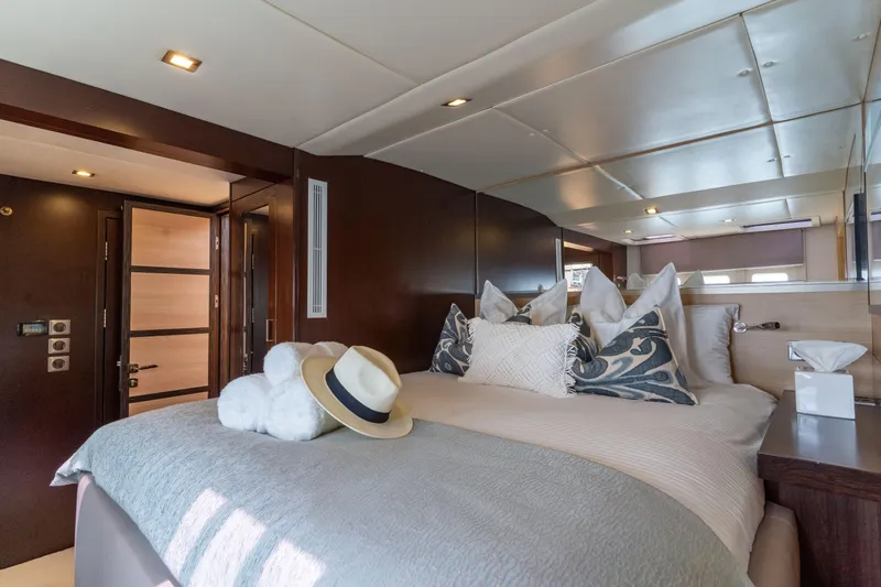 Seazen II Yacht Photos Pics Luxurious bedroom interior on 2008 Sunreef 70 yacht, featuring elegant bedding and modern design.