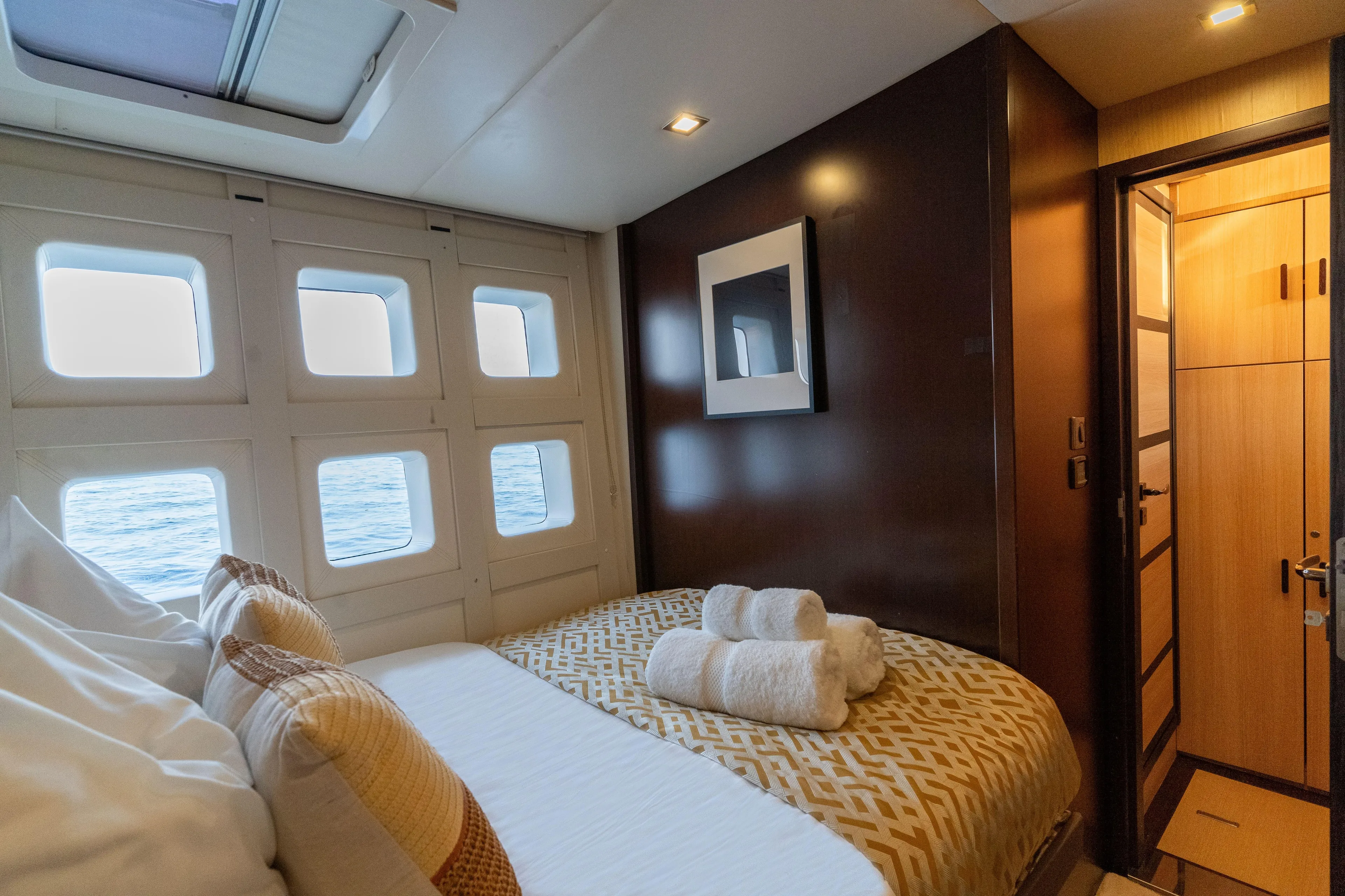 Seazen II Yacht Photos Pics Luxurious cabin interior of 2008 Sunreef 70 yacht with ocean view windows.