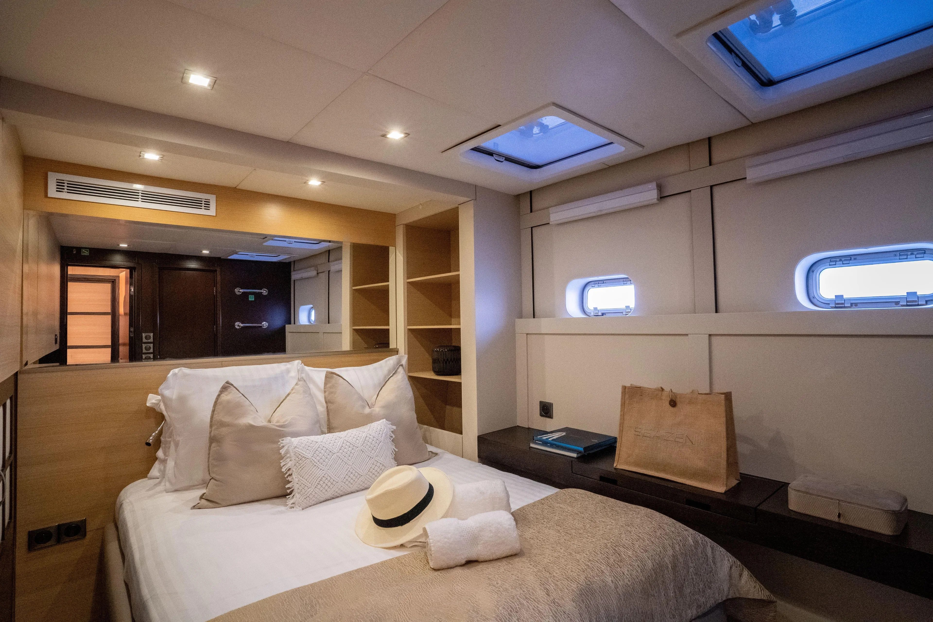 Seazen II Yacht Photos Pics Luxurious cabin interior of 2008 Sunreef 70 yacht with elegant bedding and natural light.