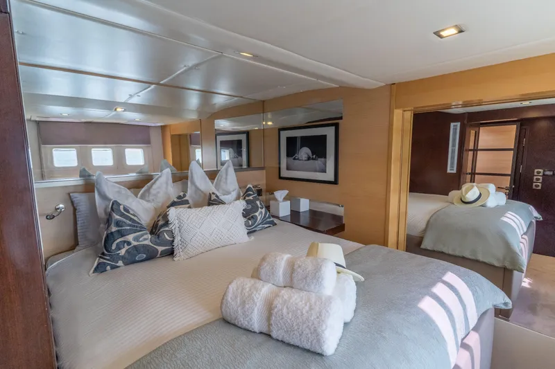 Seazen II Yacht Photos Pics Luxurious bedroom interior on 2008 Sunreef 70 yacht, featuring elegant decor and plush bedding.