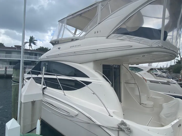 Sea Shack Yacht Photos Pics 2013 Meridian 391 yacht docked at marina under cloudy sky.