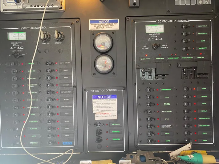 Sea Shack Yacht Photos Pics Electrical control panel of a 2013 Meridian 391 boat with gauges and switches.