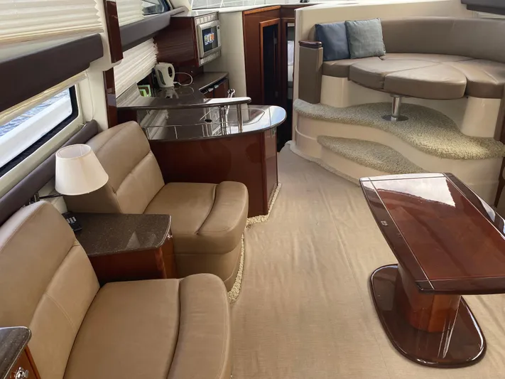 Sea Shack Yacht Photos Pics Luxurious interior of 2013 Meridian 391 yacht with elegant seating and modern furnishings.