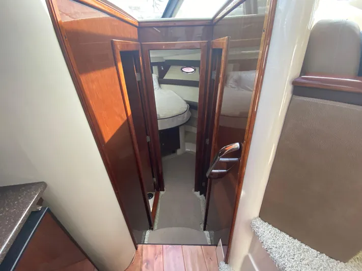 Sea Shack Yacht Photos Pics Interior view of 2013 Meridian 391 yacht cabin with wooden finishes.