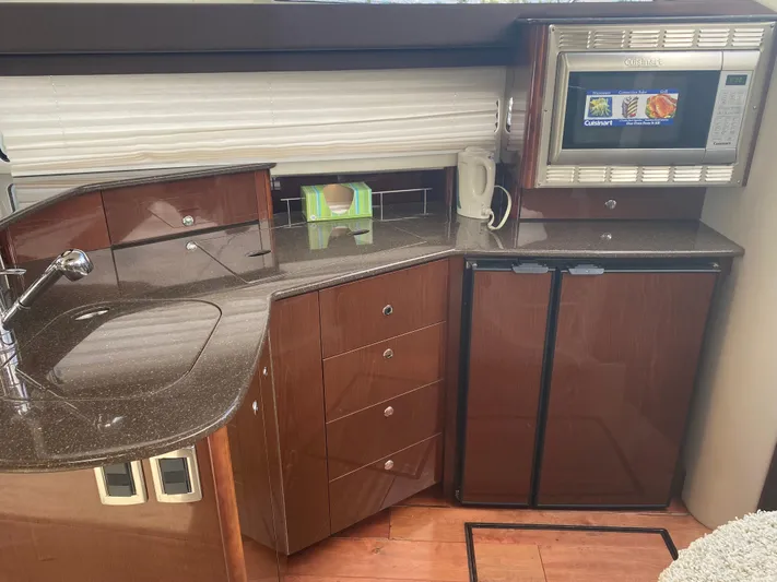 Sea Shack Yacht Photos Pics Luxurious 2013 Meridian 391 yacht kitchen with modern appliances and sleek cabinetry.