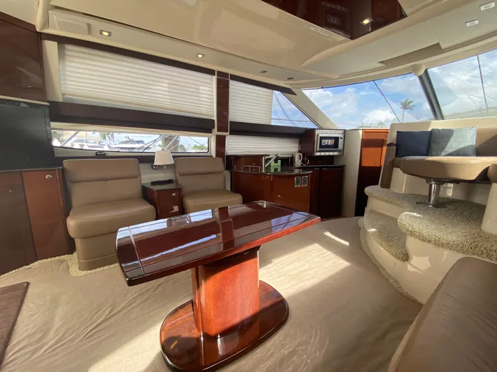 Sea Shack Yacht Photos Pics Luxurious interior of 2013 Meridian 391 yacht with elegant seating and polished wood table.