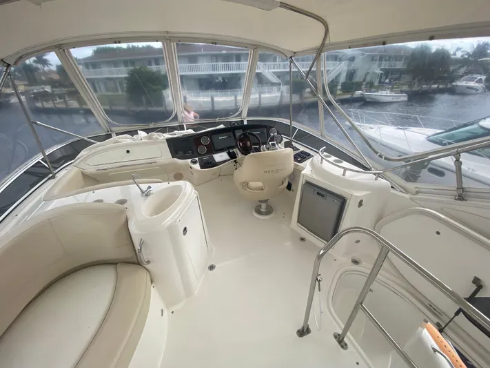 Sea Shack Yacht Photos Pics 2013 Meridian 391 yacht interior with helm, seating, and panoramic windows.