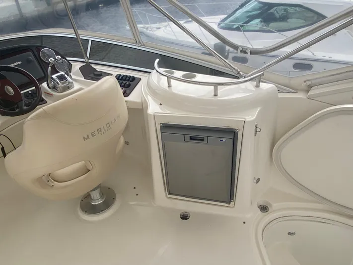 Sea Shack Yacht Photos Pics 2013 Meridian 391 yacht helm with beige seat and control panel.