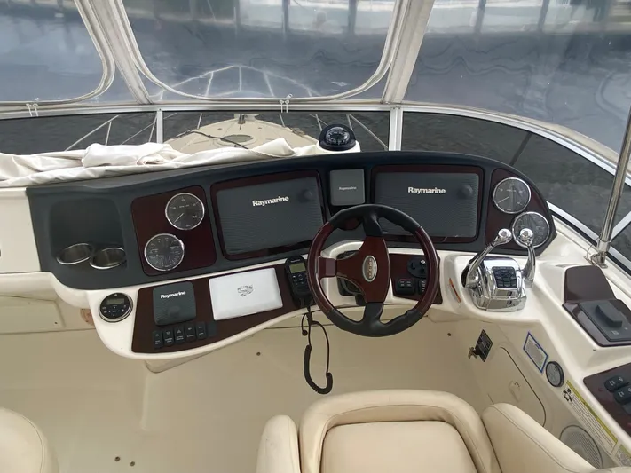 Sea Shack Yacht Photos Pics 2013 Meridian 391 yacht helm with Raymarine navigation system and luxurious controls.