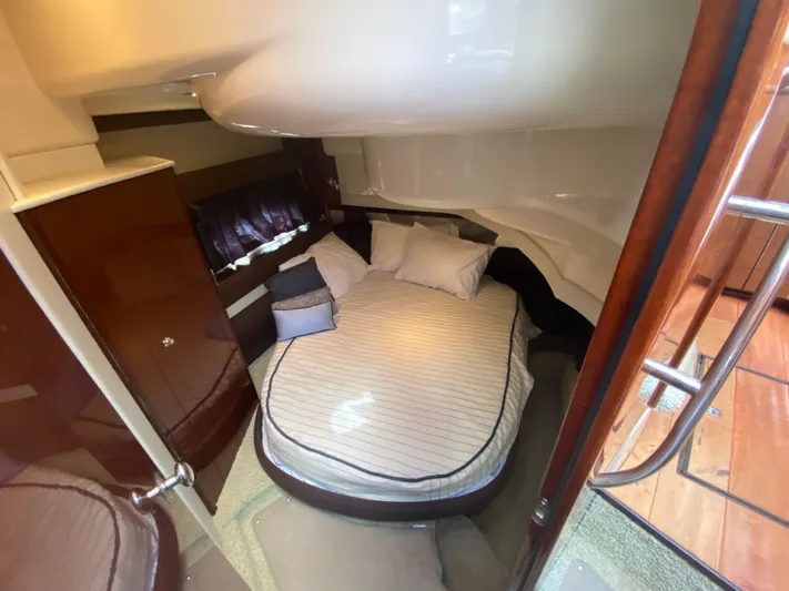 Sea Shack Yacht Photos Pics Cozy bedroom in 2013 Meridian 391 yacht with plush bedding and elegant wood finishes.