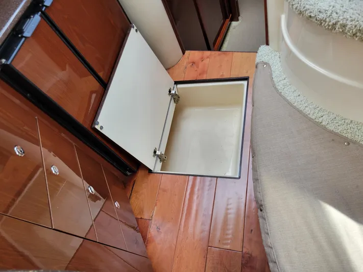 Sea Shack Yacht Photos Pics 2013 Meridian 391 yacht interior with open floor storage compartment.