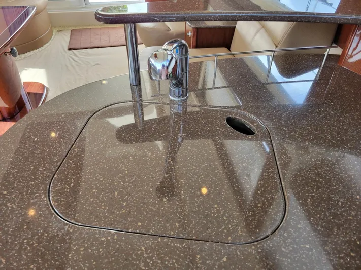 Sea Shack Yacht Photos Pics Luxurious 2013 Meridian 391 yacht kitchen with sleek countertop and modern faucet.