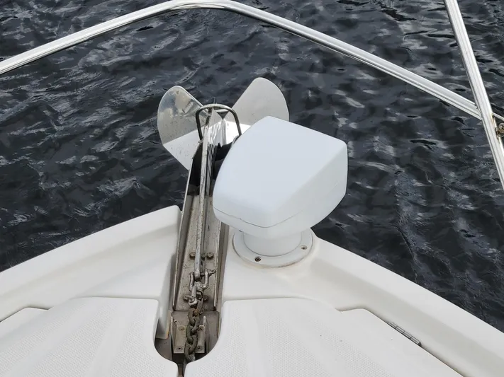 Sea Shack Yacht Photos Pics Bow of 2013 Meridian 391 yacht with anchor and calm water.