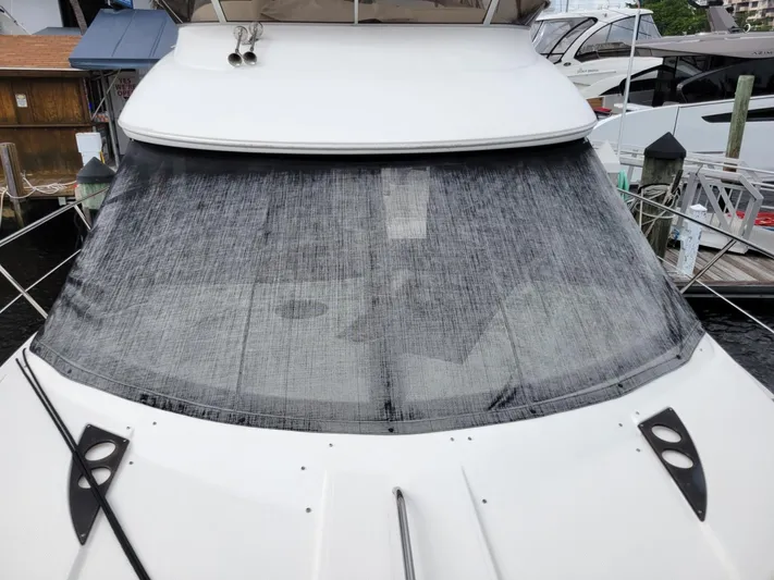 Sea Shack Yacht Photos Pics 2013 Meridian 391 yacht with covered windshield at marina dock.