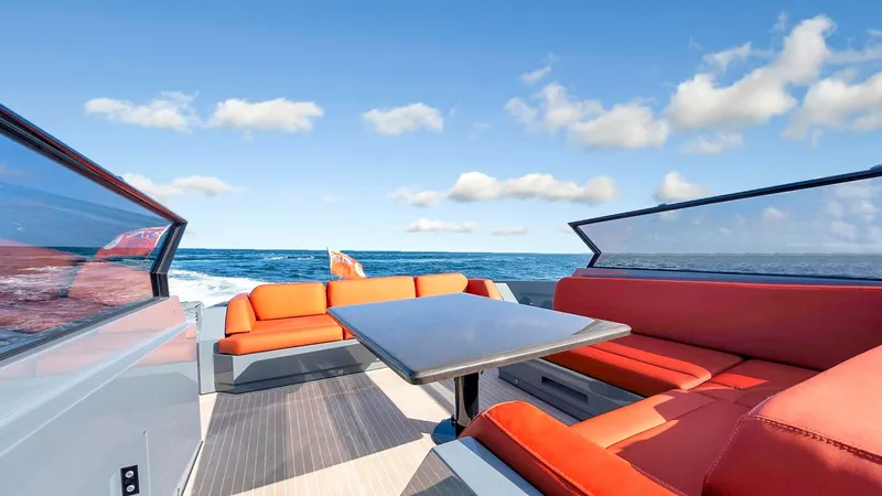 Vesper Yacht Photos Pics Luxurious 2017 Vanquish Yachts VQ 54 with vibrant orange seating and ocean view.