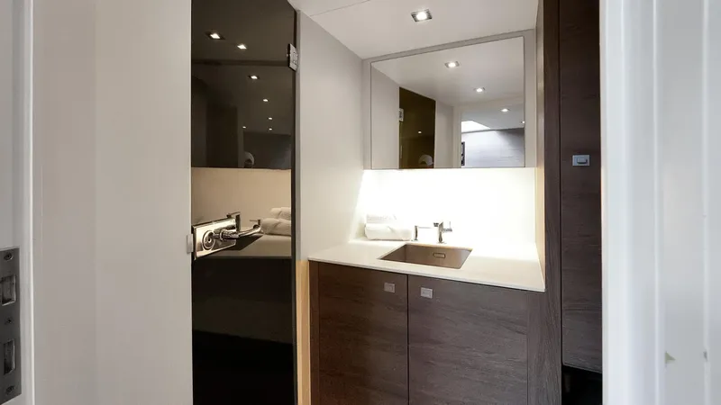 Vesper Yacht Photos Pics Interior of 2017 Vanquish Yachts VQ 54, featuring modern kitchenette design.