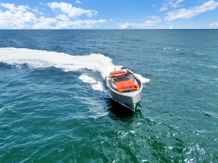 Vesper Yacht Photos Pics Vanquish Yachts VQ 54 (2017) cruising on open sea under clear blue sky.