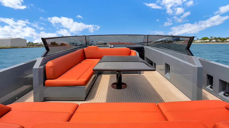 Vesper Yacht Photos Pics Luxurious 2017 Vanquish Yachts VQ 54 with orange seating and sleek design on open water.