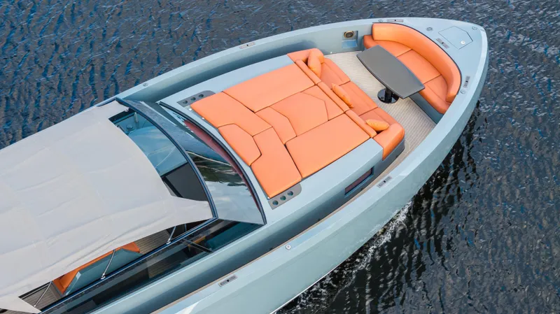 Vesper Yacht Photos Pics 2017 Vanquish Yachts VQ 54 with orange seating, cruising on water.
