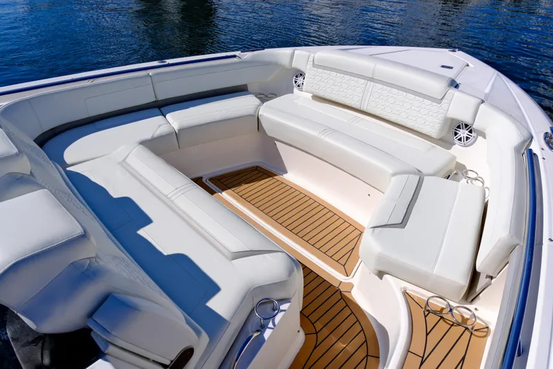 Feeling Knotty Yacht Photos Pics Luxurious seating area on 2023 Tiara Yachts 48 LS, featuring elegant white upholstery.
