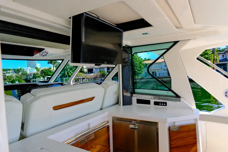 Feeling Knotty Yacht Photos Pics Luxurious interior of 2023 Tiara Yachts 48 LS with modern amenities and scenic views.