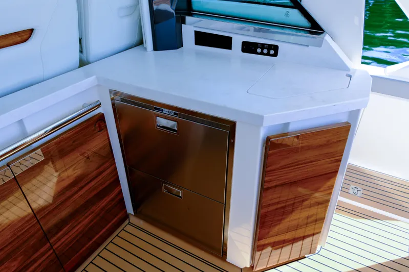 Feeling Knotty Yacht Photos Pics 2023 Tiara Yachts 48 LS interior with sleek cabinetry and modern appliances.