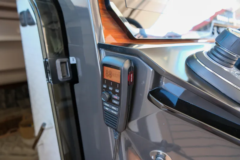 Feeling Knotty Yacht Photos Pics 2023 Tiara Yachts 48 LS yacht dashboard with mounted communication device.
