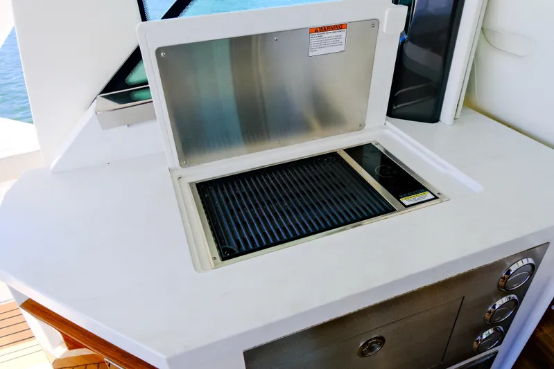 Feeling Knotty Yacht Photos Pics Outdoor grill on 2023 Tiara Yachts 48 LS, featuring sleek design and modern amenities.