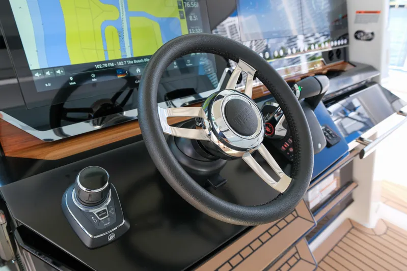 Feeling Knotty Yacht Photos Pics 2023 Tiara Yachts 48 LS helm with modern navigation displays and controls.