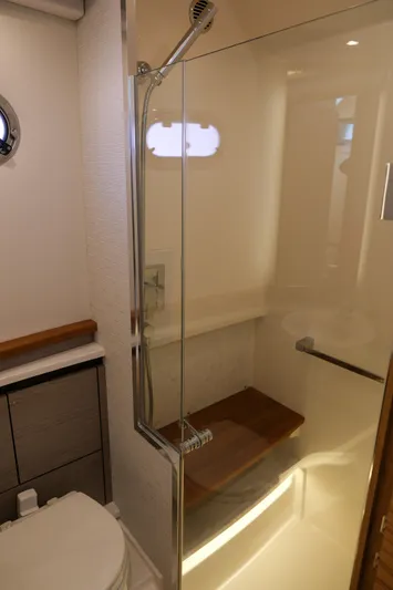 Feeling Knotty Yacht Photos Pics 2023 Tiara Yachts 48 LS bathroom with modern shower and sleek design.