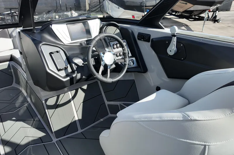  Yacht Photos Pics Interior of 2025 Supreme S220 boat, featuring modern dashboard and steering wheel design.