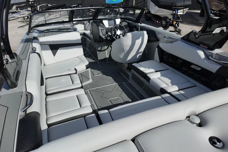  Yacht Photos Pics Luxurious interior of 2025 Supreme S220 boat with modern seating and sleek design.